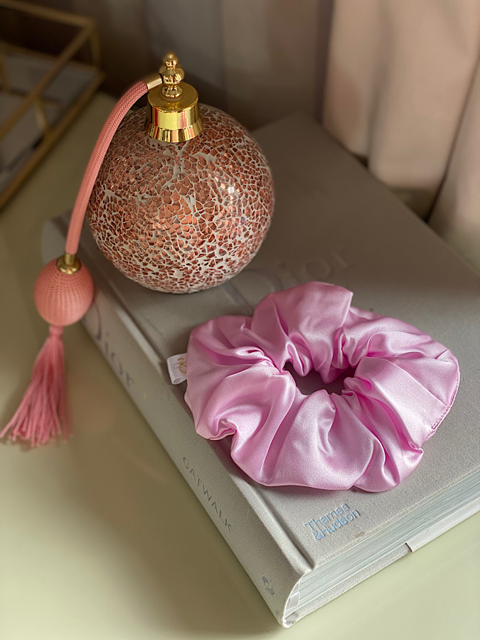 Silk bubble gum scrunchie on a dior book