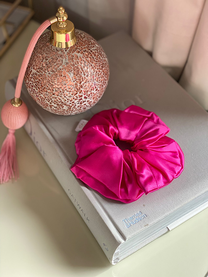 Silk fushia scrunchie on a dior book