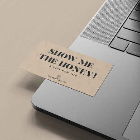 The Pretty Bee Co. E-Giftcard resting on a laptop