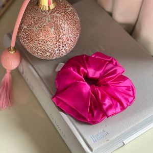 Silk fushia scrunchie on a dior book